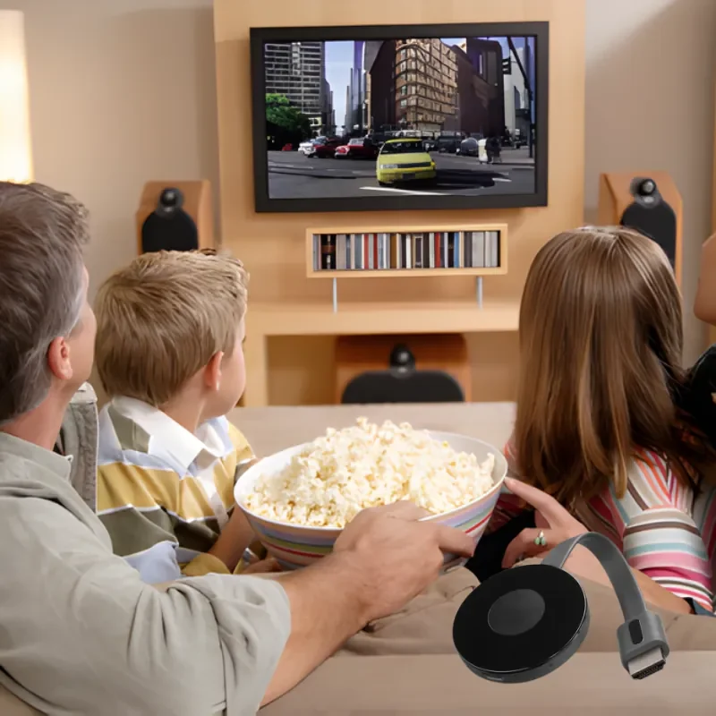Step 3: Family watching a television with the PlayVero adapter shown